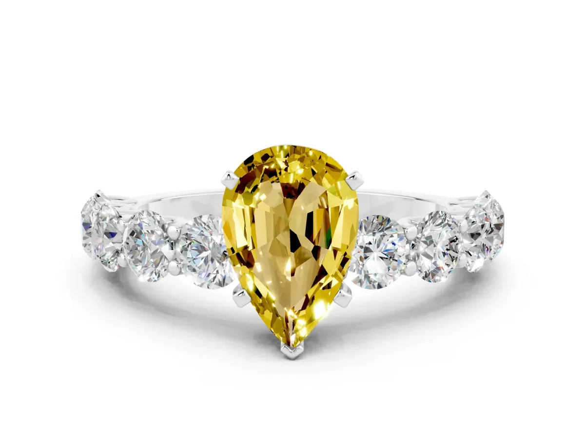 Pear Cut Yellow Sapphire Prong Setting with Side Stones on a Pave Band Silver
