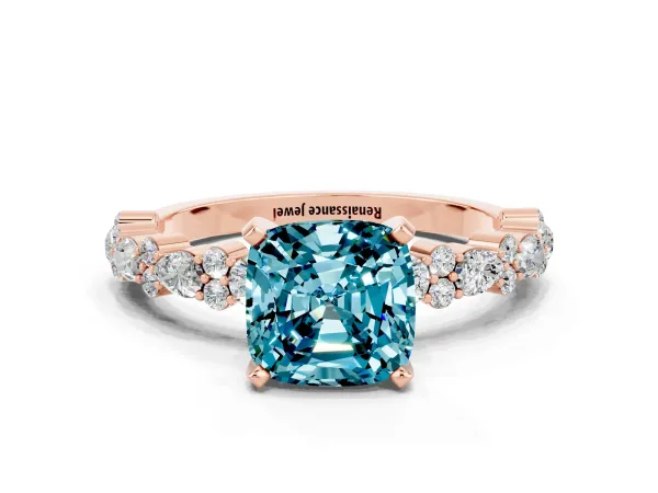 Cushion Cut Blue Topaz Side Stone Solitaire Ring with Round and Four-Prong Setting Rose gold