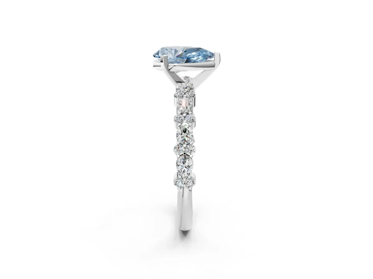 Fancy Blue Pear Cut Diamond Side Stone Solitaire Ring with Round and Four-Prong Setting Silver