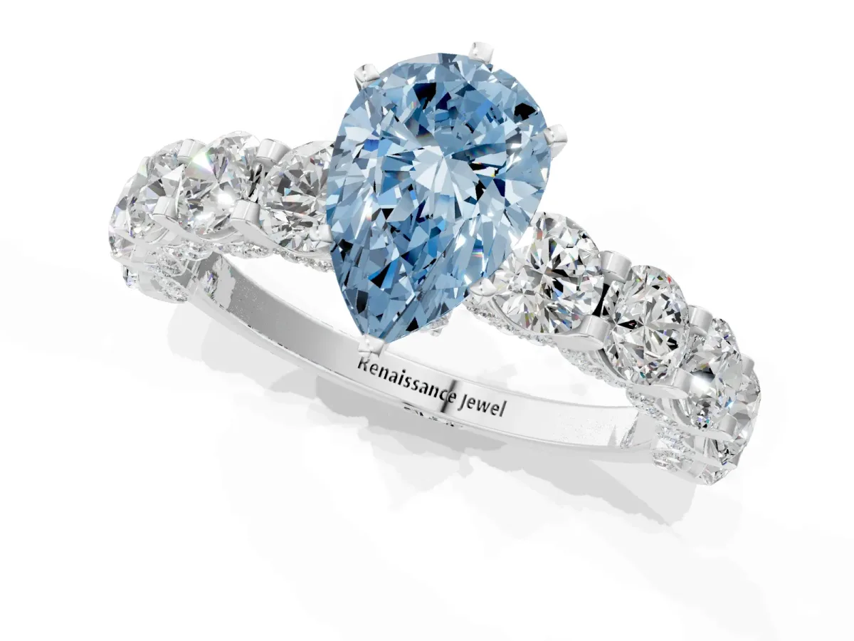 Fancy Blue Pear Cut Diamond Side Stone Engagement Ring with Four-Prong Setting White gold