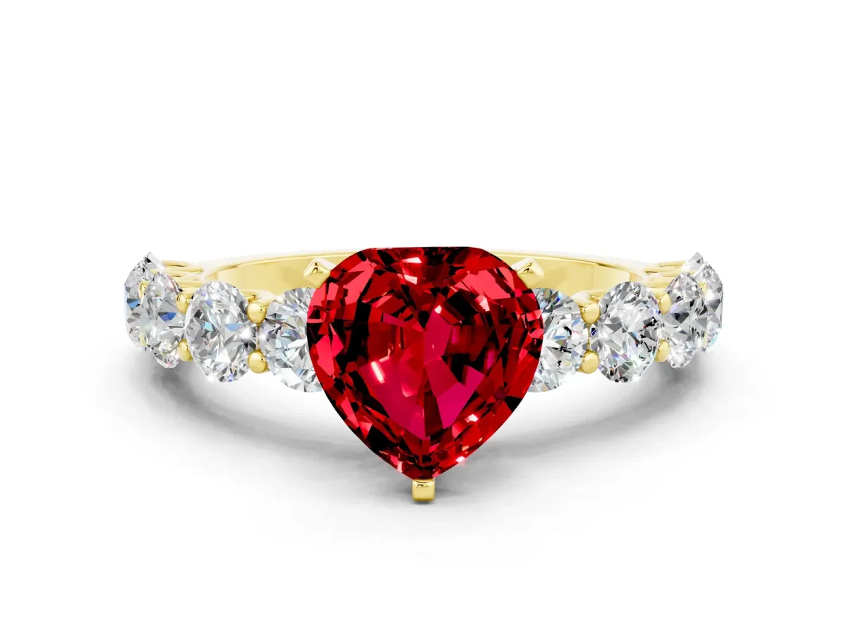 Heart Cut Ruby Prong Setting with Side Stones on a Pave Band Yellow gold
