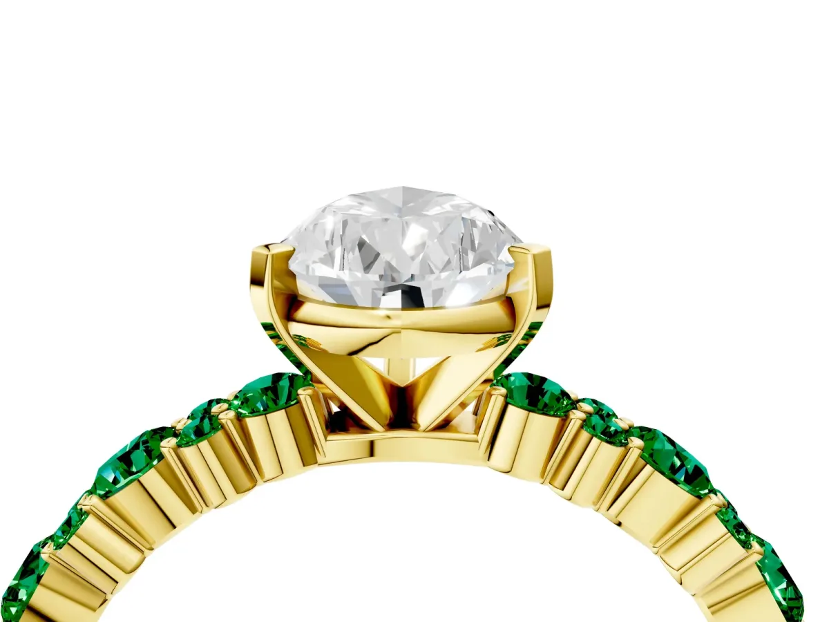 Pear Cut Diamond Side Stone Solitaire Ring with Round Emerald and Four-Prong Setting Yellow gold