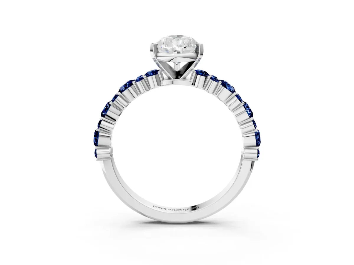 Pear Cut Diamond Side Stone Solitaire Ring with Round Blue Sapphire and Four-Prong Setting Silver
