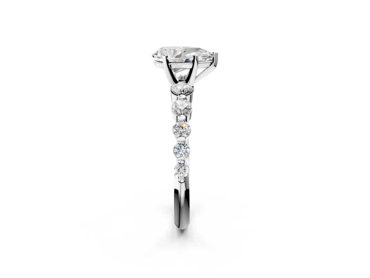 Pear Cut Solitaire Diamond Ring with Pave Band and Four-Prong Setting Platinum