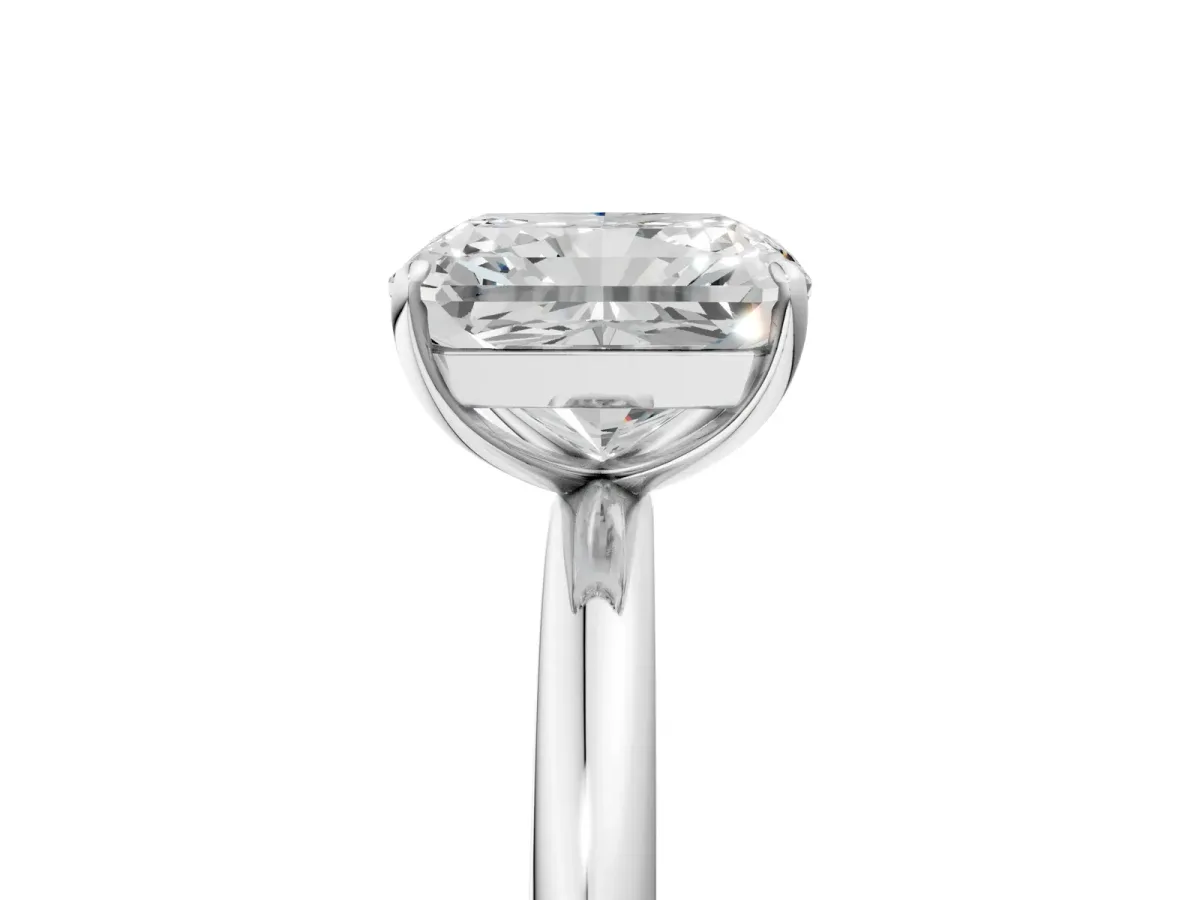 Radiant Cut Solitaire Diamond Ring with Four-Prong Setting on a Plain Band Platinum