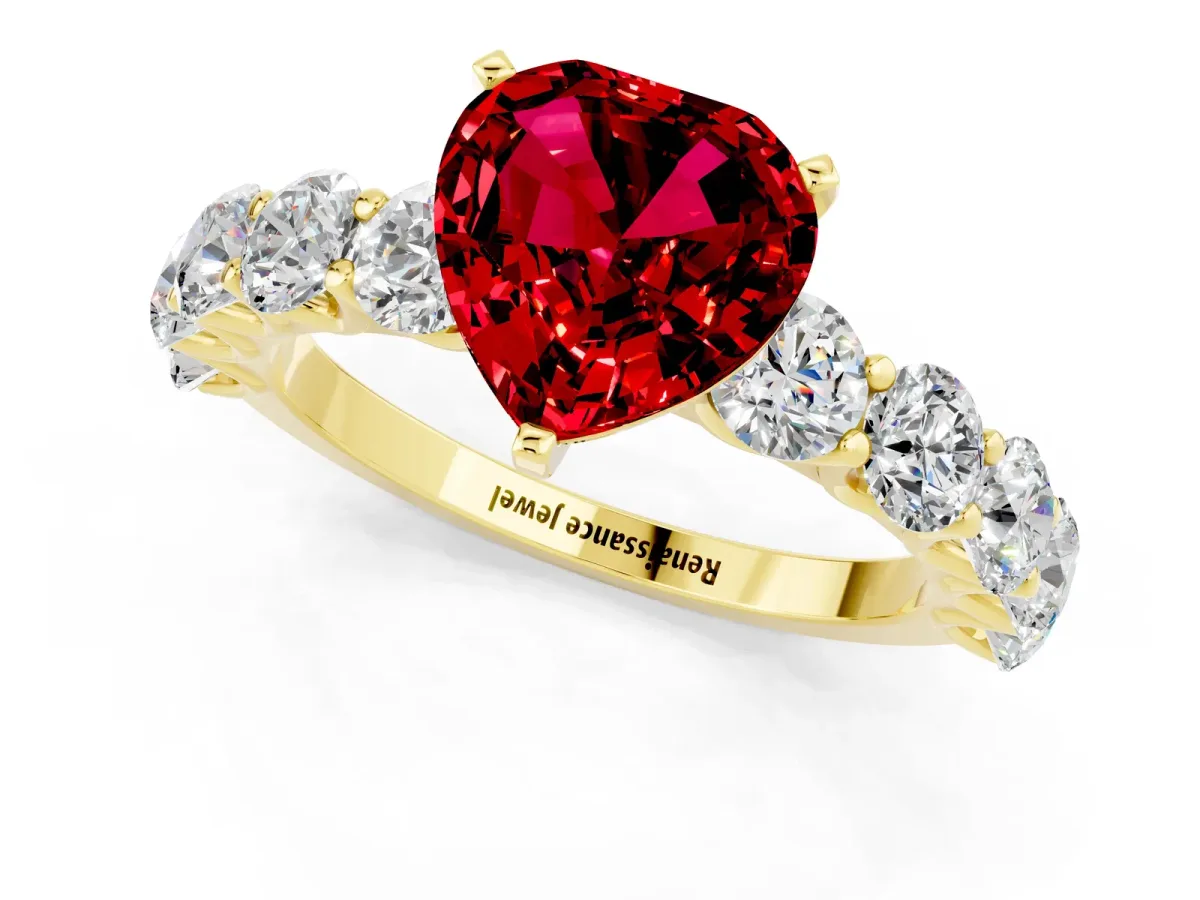 Heart Cut Ruby Prong Setting with Side Stones on a Pave Band Yellow gold
