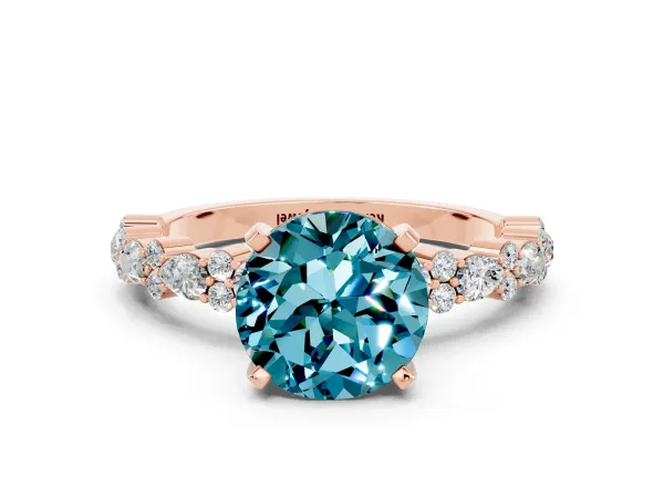 Round Cut Blue Topaz Side Stone Solitaire Ring with Round and Four-Prong Setting Rose gold