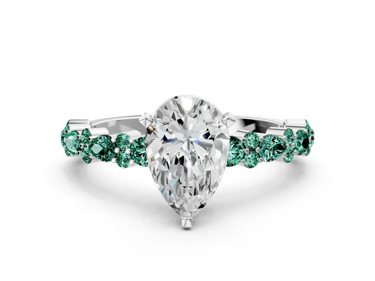 Pear Cut Diamond Side Stone Solitaire Ring with Round Green Sapphire and Four-Prong Setting Silver