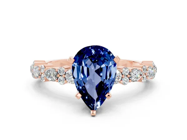 Pear Cut Blue Sapphire Side Stone Solitaire Ring with Round and Four-Prong Setting Rose gold