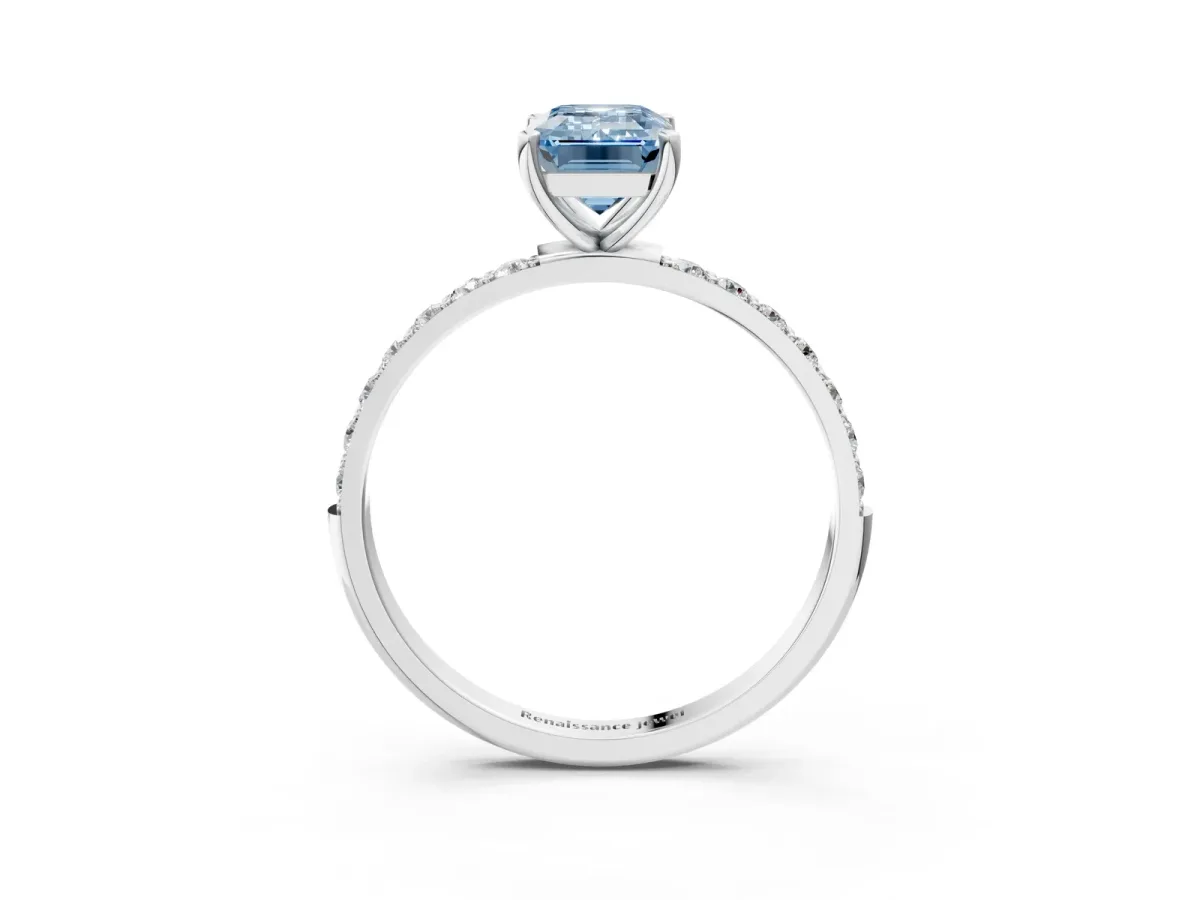 Fancy Blue Emerald Cut Diamond Solitaire Ring with Round Pavé Shoulders and Prong Setting Silver