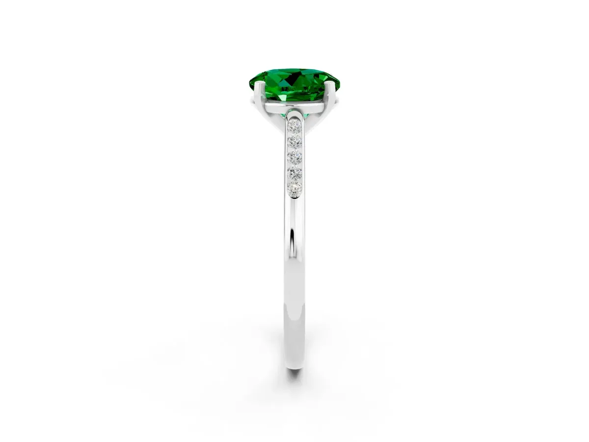 Round Cut Emerald Solitaire Ring with Channel Set Round Band and Prong Setting Platinum