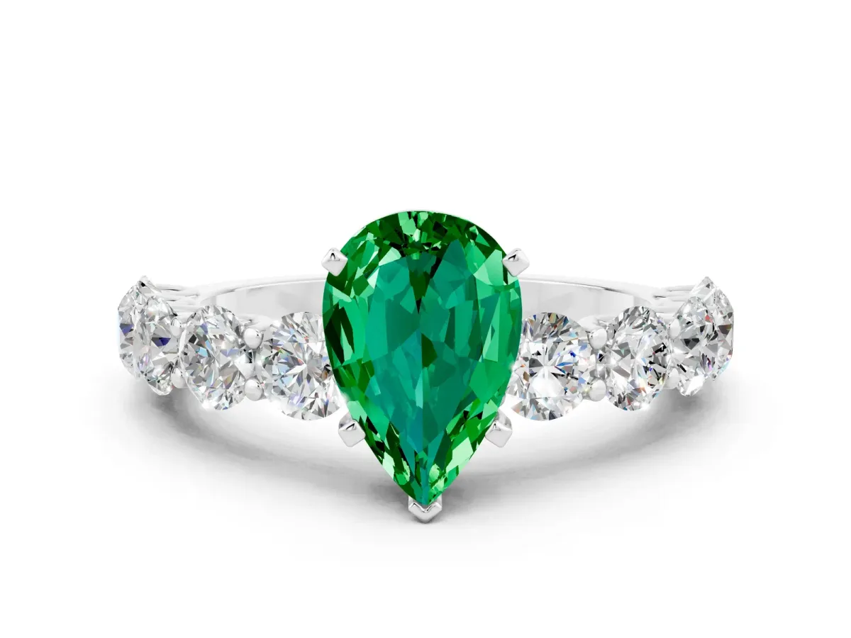 Pear Cut Emerald Prong Setting with Side Stones on a Pave Band Silver
