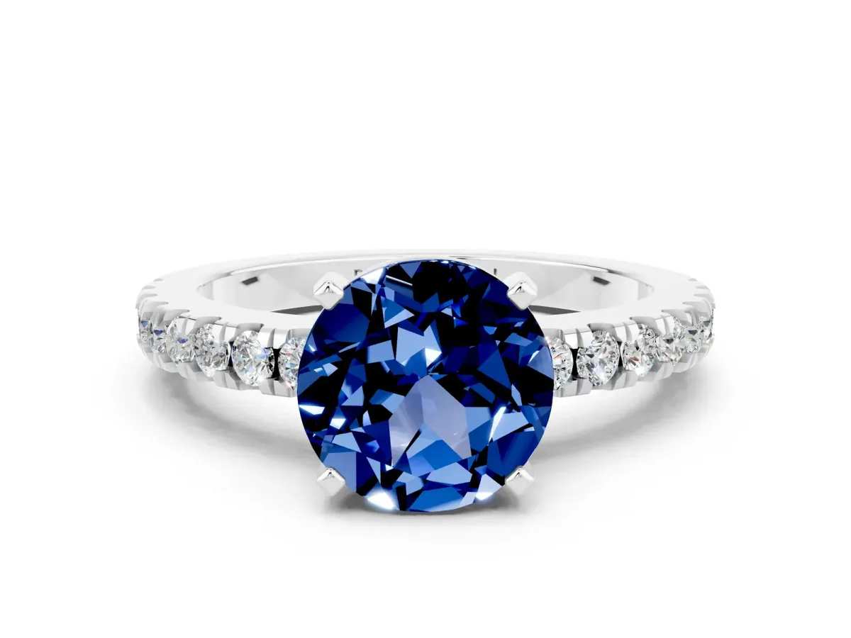 Round Cut Solitaire Blue Sapphire with Pavé Band and Four-Prong Setting Silver