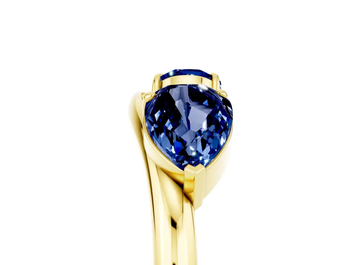 Two-Stone Pear Blue Sapphire Bypass Ring with Prong Setting Yellow gold