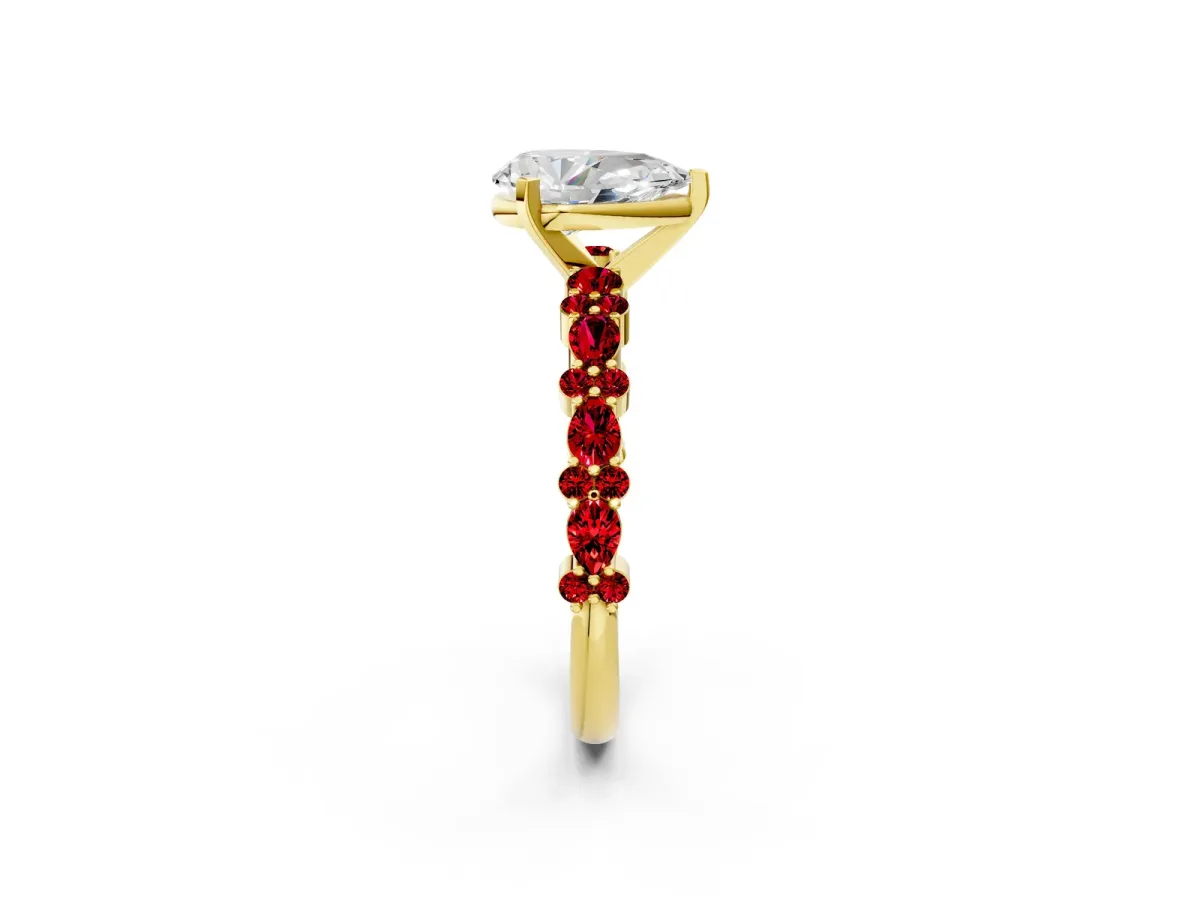 Pear Cut Diamond Side Stone Solitaire Ring with Round Ruby and Four-Prong Setting Yellow gold