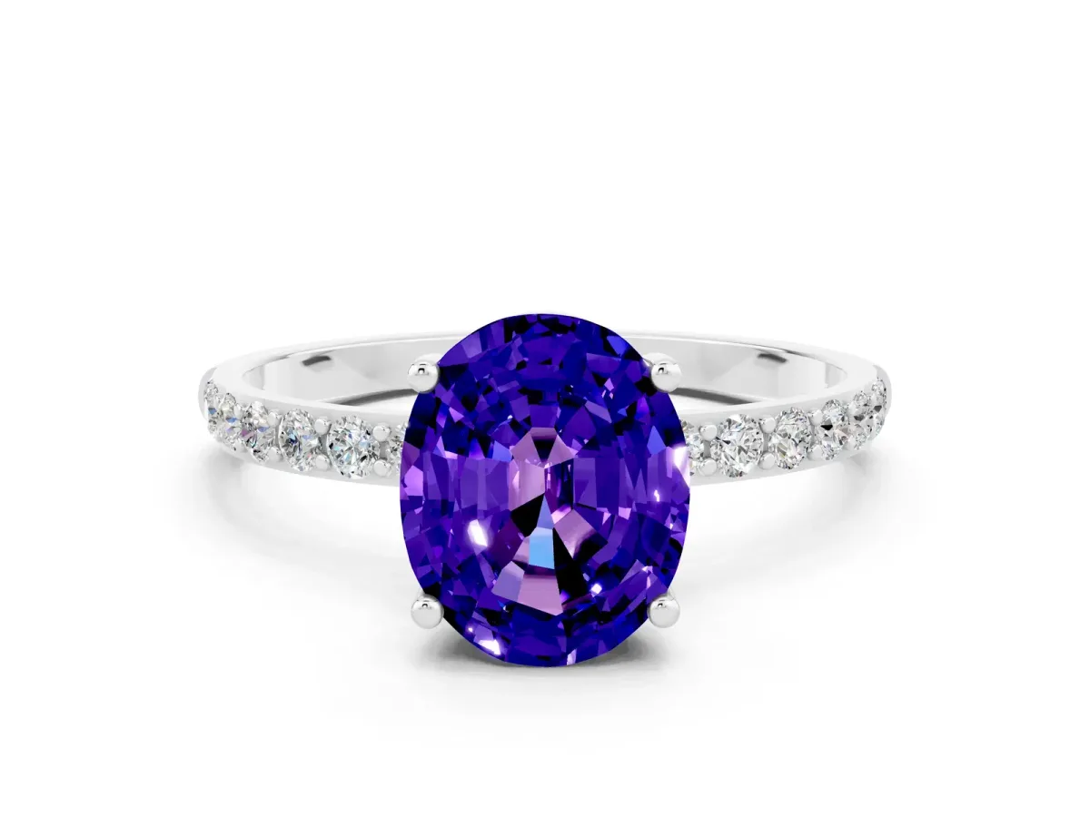 Oval Cut Tanzanite Solitaire Ring with Round Pavé Band and Prong Setting Silver