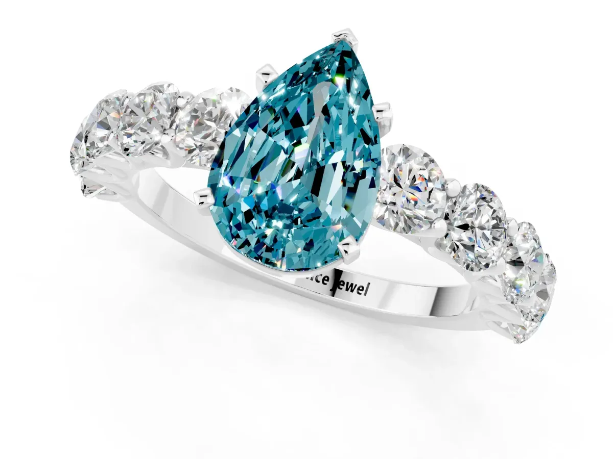Pear Cut Blue Topaz Prong Setting with Side Stones on a Pave Band Silver