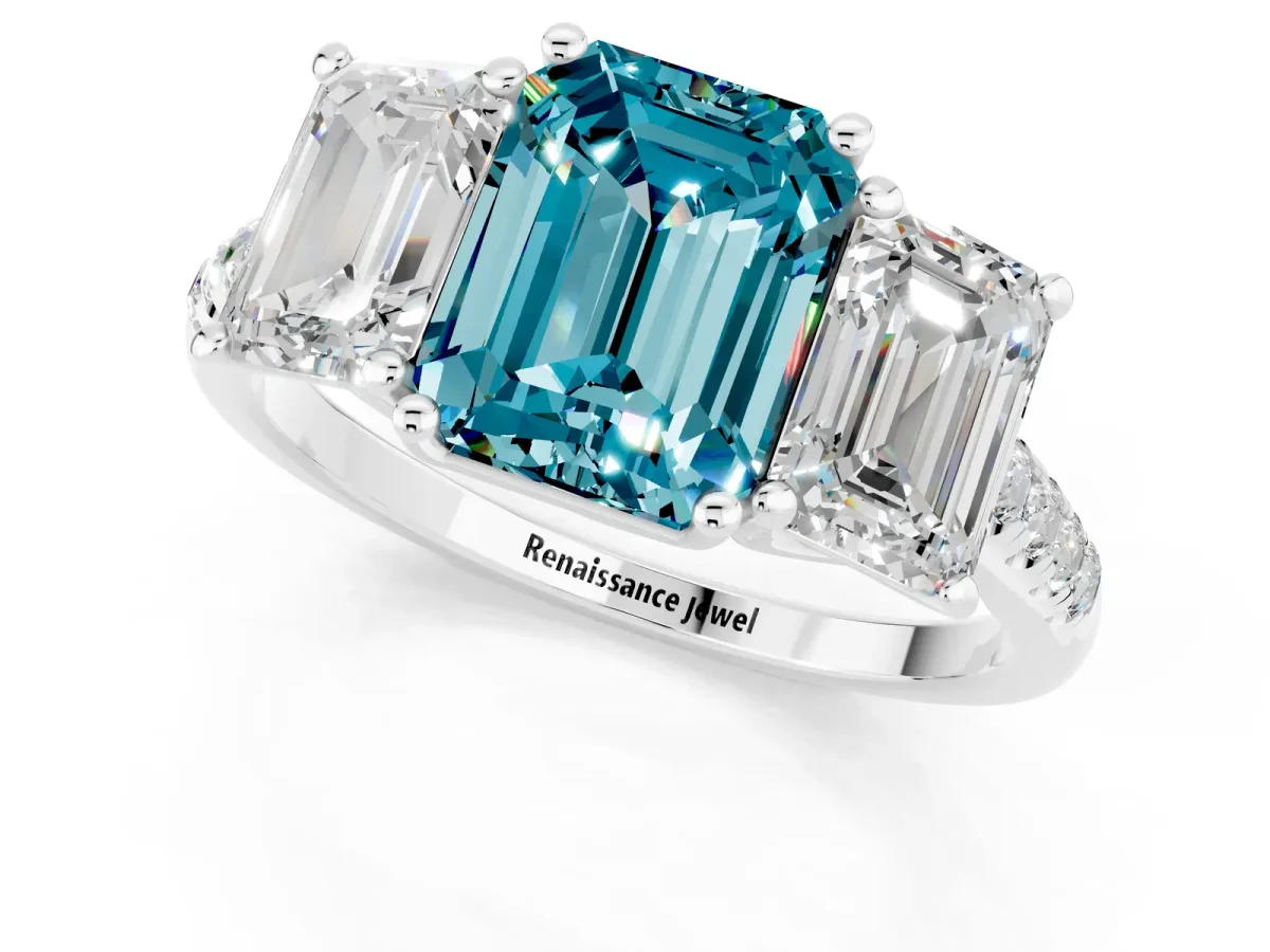Three-Stone Emerald Cut Blue Topaz Ring with Round Pavé Band and Prong Setting Platinum