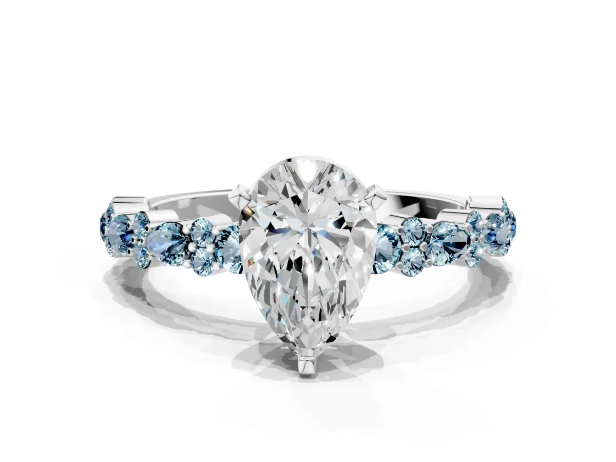 Pear Cut Diamond Side Stone Solitaire Ring with Round Aquamarine and Four-Prong Setting Silver