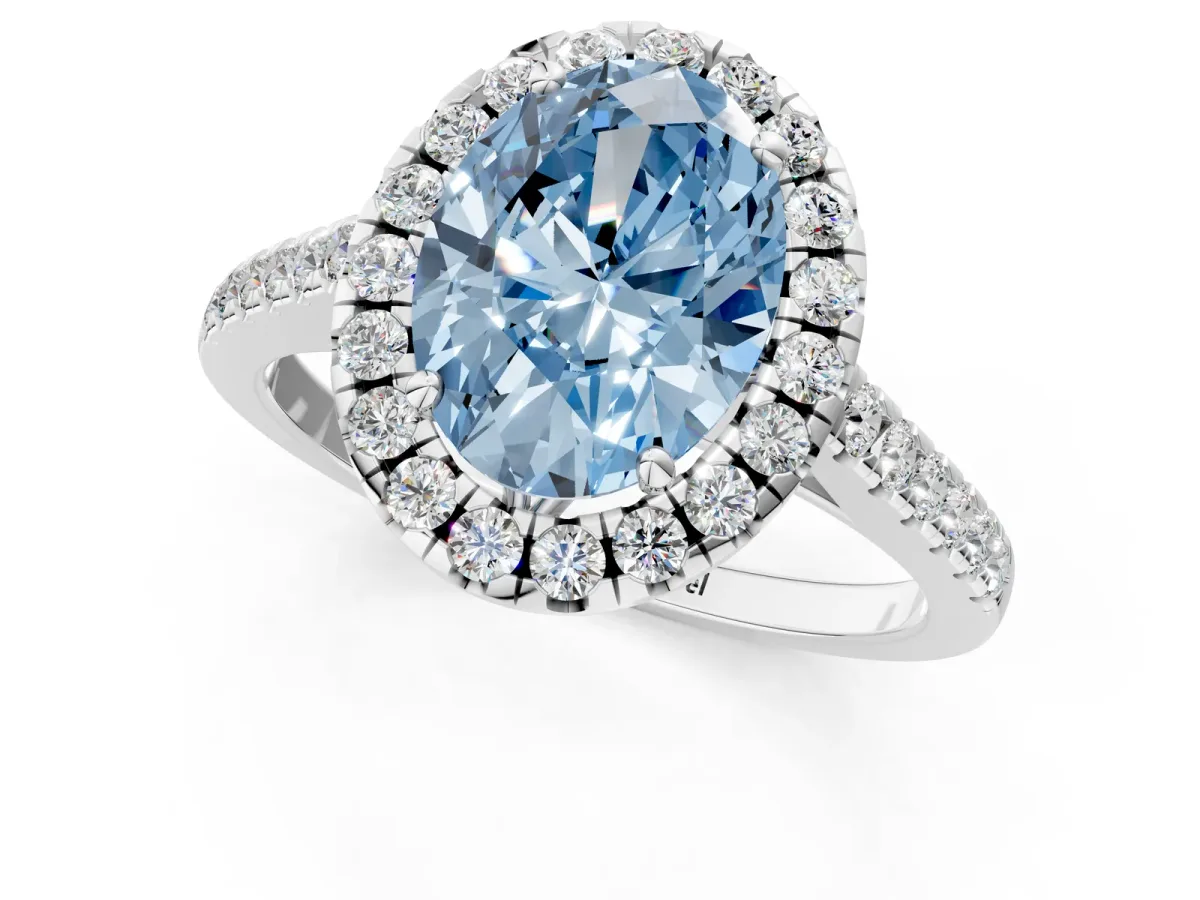 Fancy Blue Oval Cut Halo Pavé Diamond Engagement Ring with Four-Prong Setting Silver