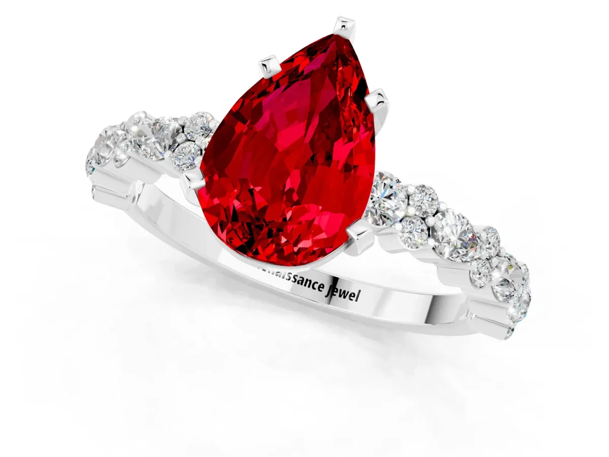 Pear Cut Ruby Side Stone Solitaire Ring with Round and Four-Prong Setting Silver