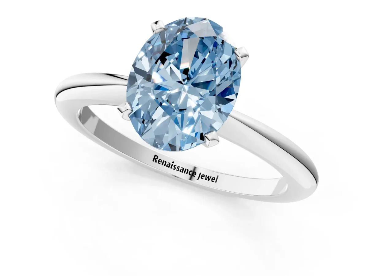 Fancy Blue Oval Cut Diamond Solitaire Ring with Six-Prong Setting and Classic Band Platinum
