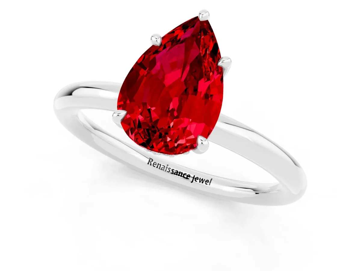Pear Cut Ruby Solitaire Ring with Thin Band and Four-Prong Setting Silver