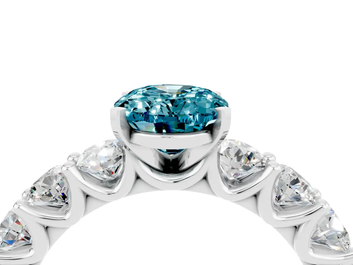 Oval Cut Blue Topaz Prong Setting with Side Stones on a Pave Band Silver