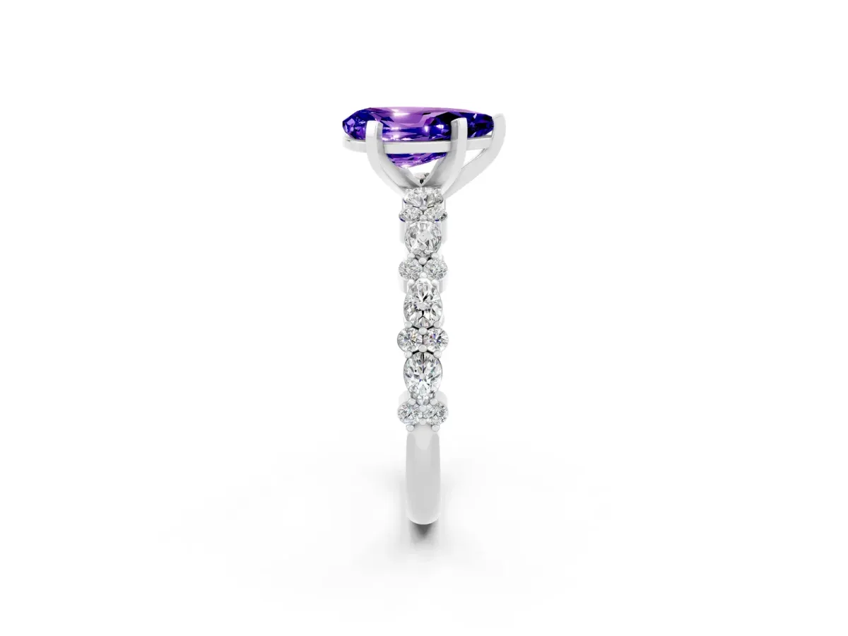 Pear Cut Tanzanite Side Stone Solitaire Ring with Round and Four-Prong Setting White gold