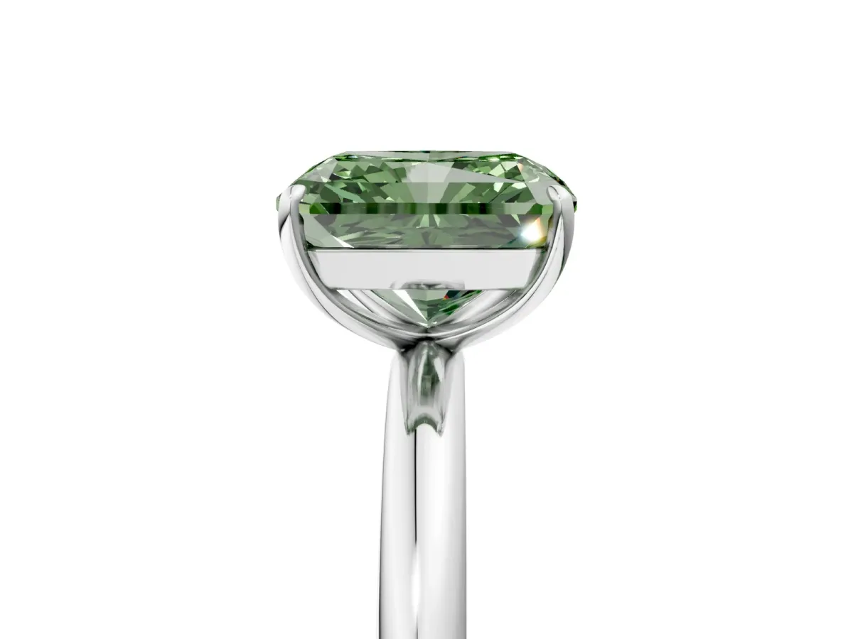 Fancy Green Radiant Cut Solitaire Diamond Ring with Four-Prong Setting on a Plain Band Platinum