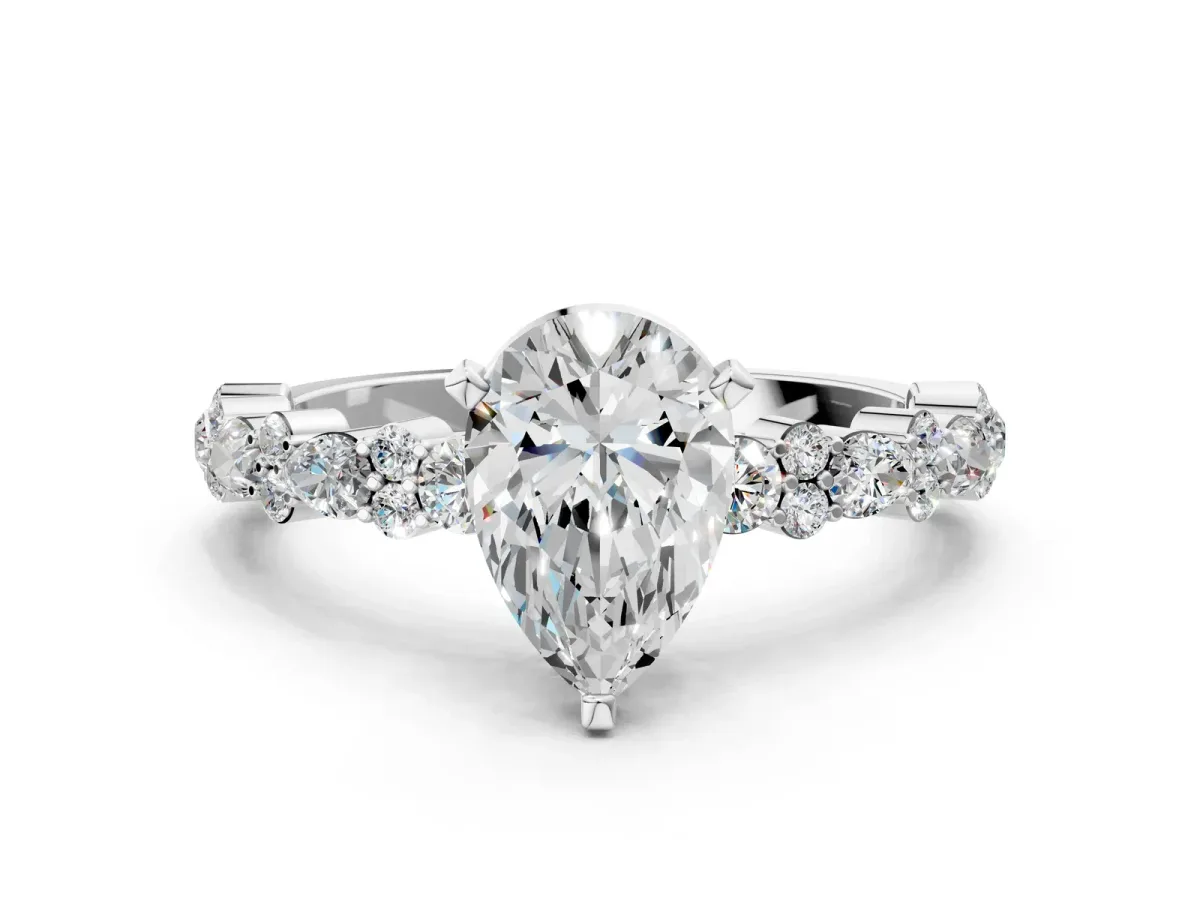 Pear Cut Diamond Side Stone Solitaire Ring with Round and Four-Prong Setting Platinum