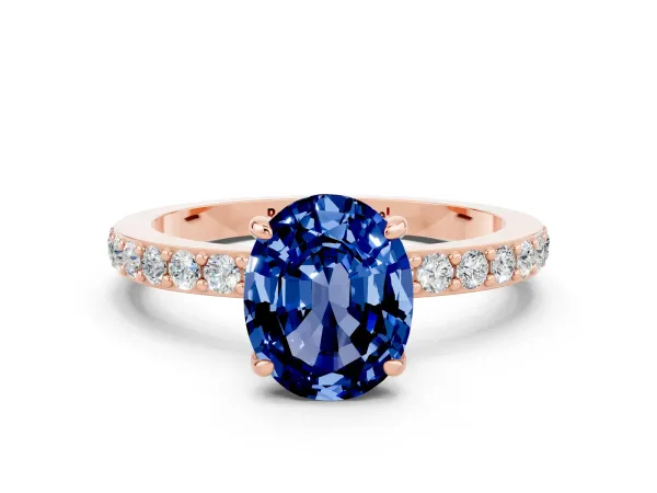 Oval Cut Blue Sapphire Solitaire Engagement Ring with Pavé Band and Four-Prong Setting Rose gold