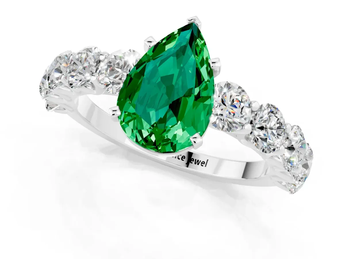 Pear Cut Emerald Prong Setting with Side Stones on a Pave Band Silver