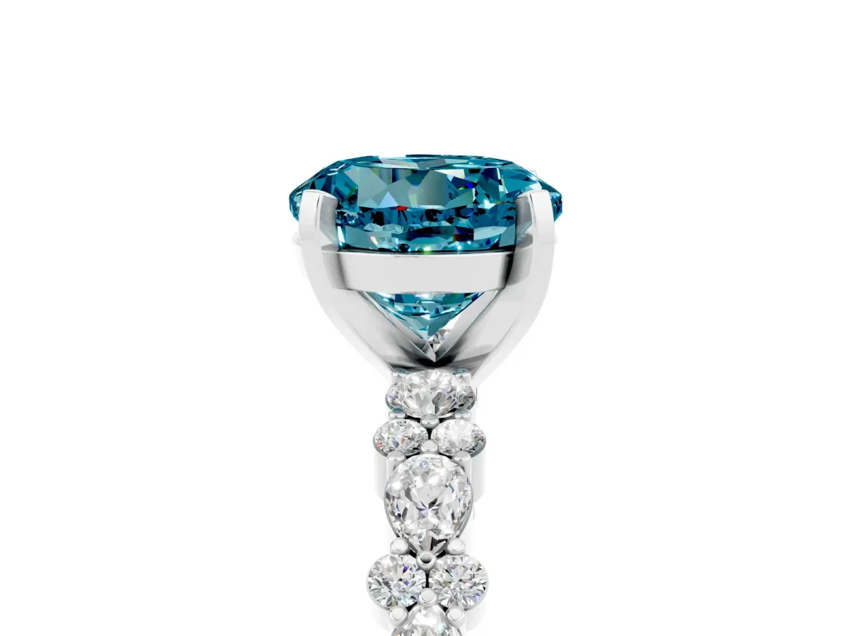 Round Cut Blue Topaz Side Stone Solitaire Ring with Round and Four-Prong Setting Silver