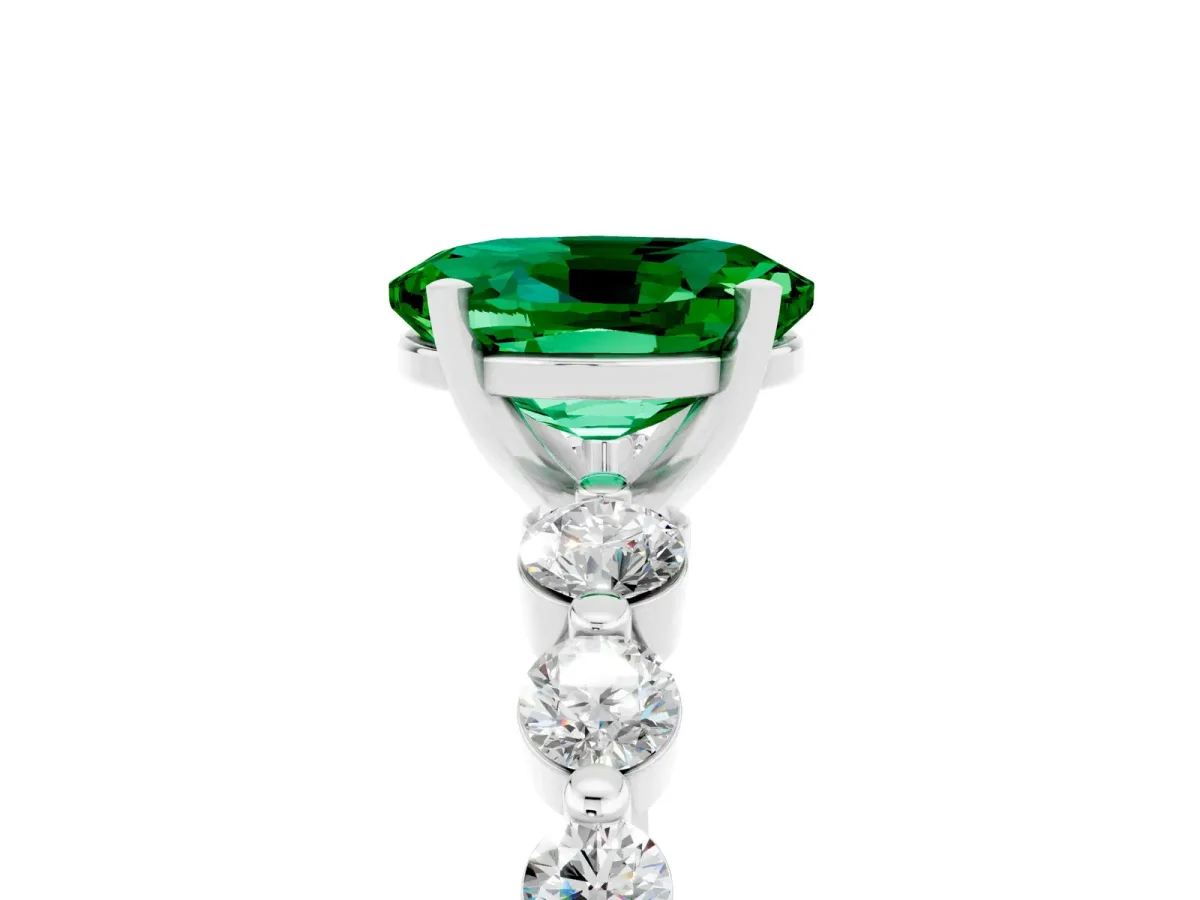 Oval Cut Solitaire Emerald Ring with Pave Band and Four-Prong Setting Silver