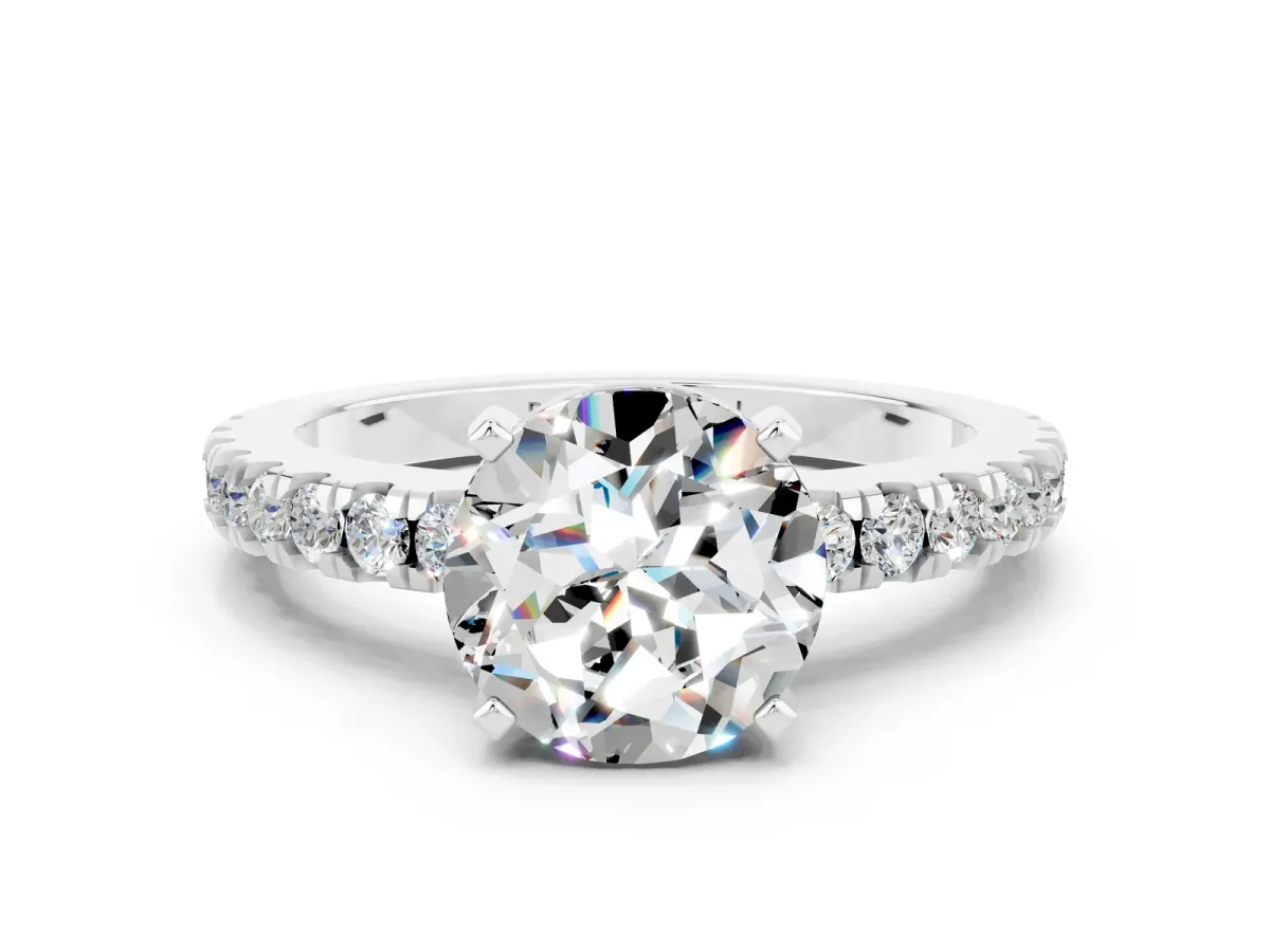 Round Cut Solitaire Moissanite with Pavé Band and Four-Prong Setting Silver