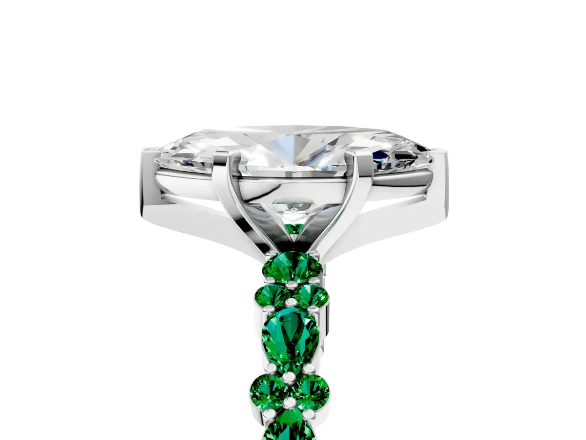 Marquise Cut Diamond Side Stone Solitaire Ring with Round Emerald and Four-Prong Setting Platinum