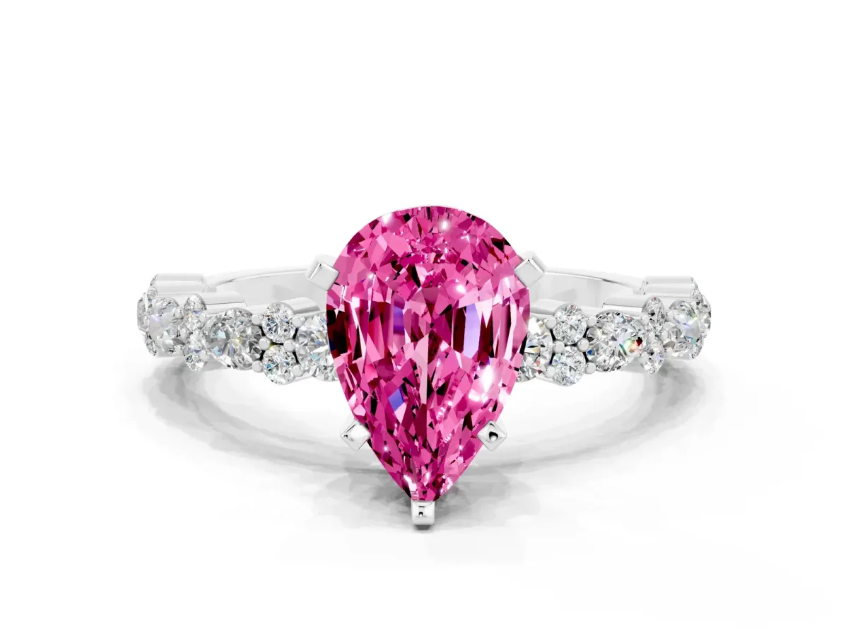 Pear Cut Pink Sapphire Side Stone Solitaire Ring with Round and Four-Prong Setting Silver