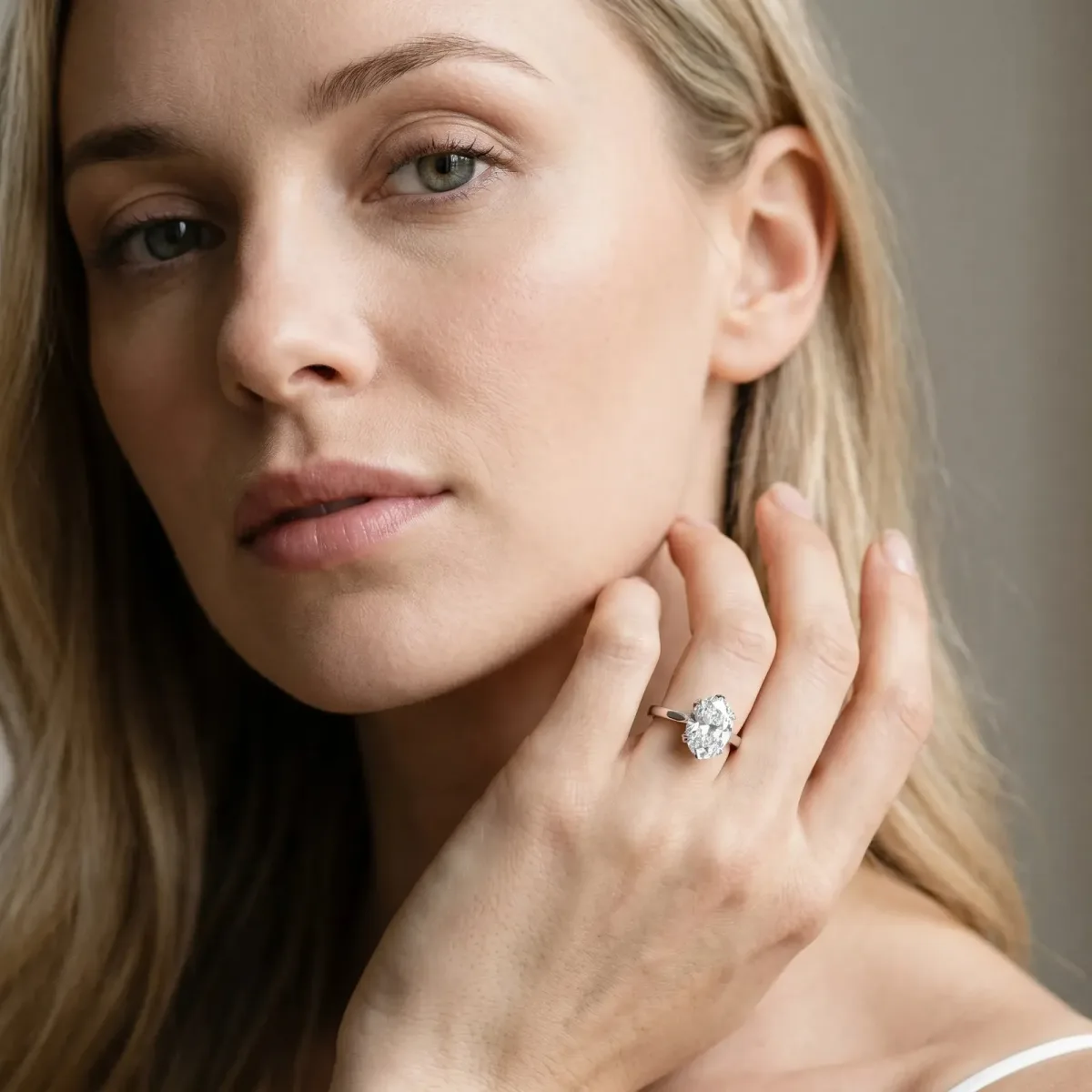 Oval Cut Diamond Solitaire Ring with Flower Prong Setting and Classic Band Silver