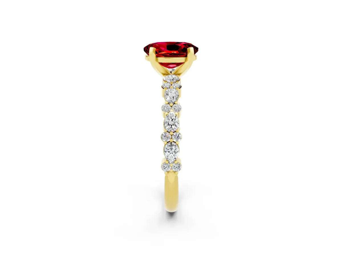 Oval Cut Ruby Side Stone Solitaire Ring with Round and Four-Prong Setting Yellow gold