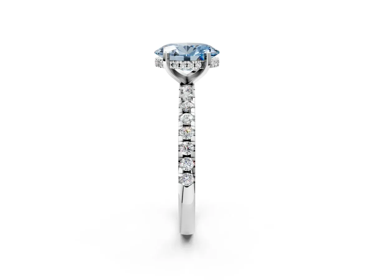 Fancy Blue Oval Cut Diamond Solitaire Ring with Round Pavé Band and Four-Prong Setting Silver