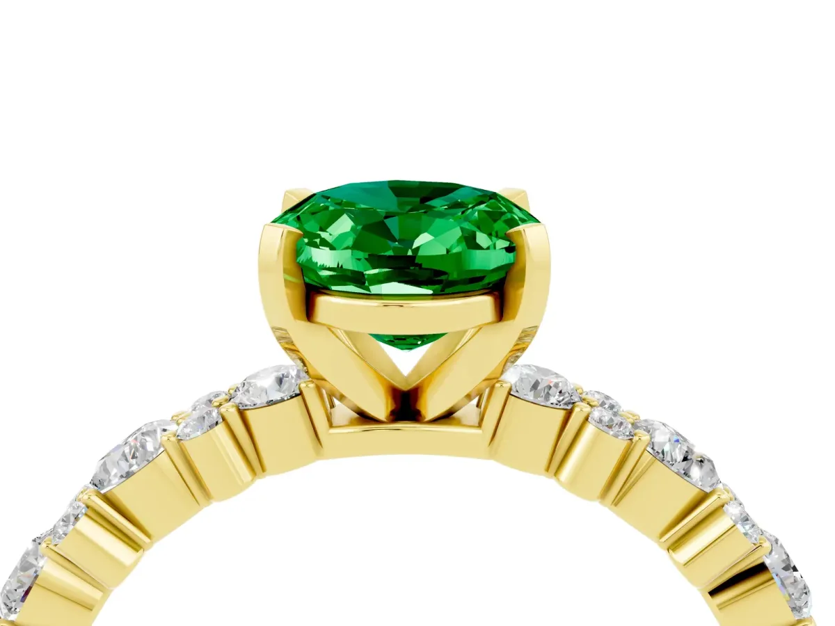 Oval Cut Emerald Side Stone Solitaire Ring with Round and Four-Prong Setting Yellow gold