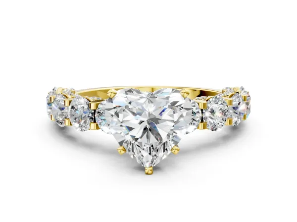 Heart Cut Diamond Side Stone Engagement Ring with Four-Prong Setting Yellow gold