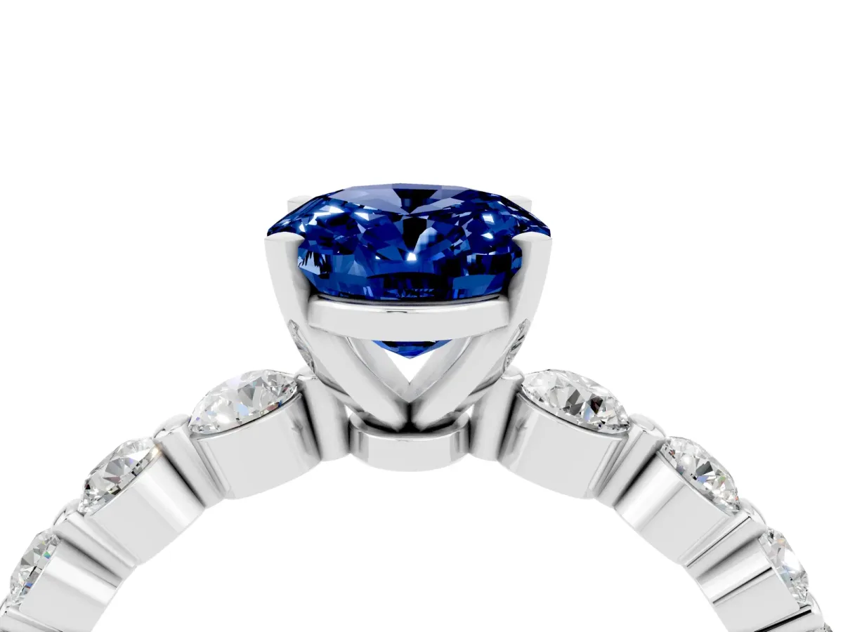 Oval Cut Solitaire Blue Sapphire Ring with Pave Band and Four-Prong Setting Silver