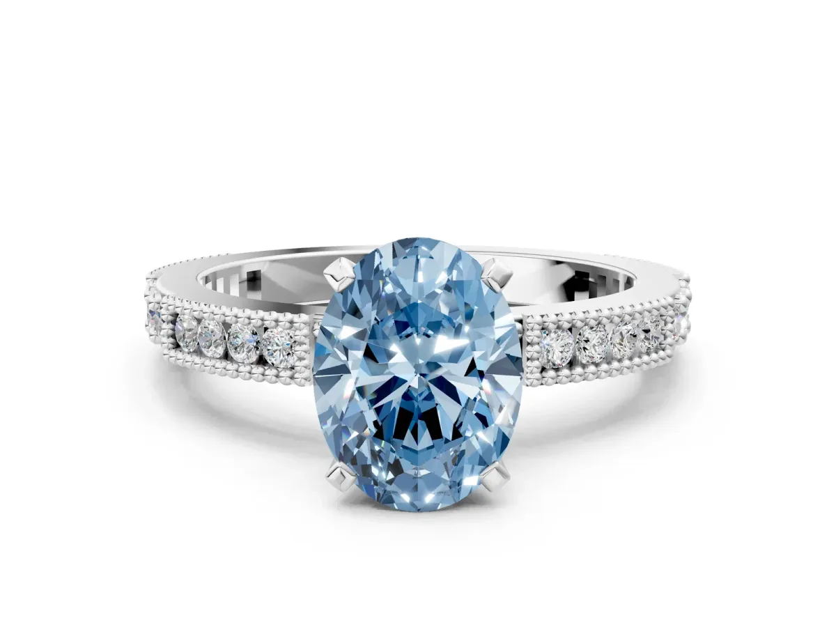 Fancy Blue Oval Cut Solitaire with Pavé Band and Four-Prong Setting Silver