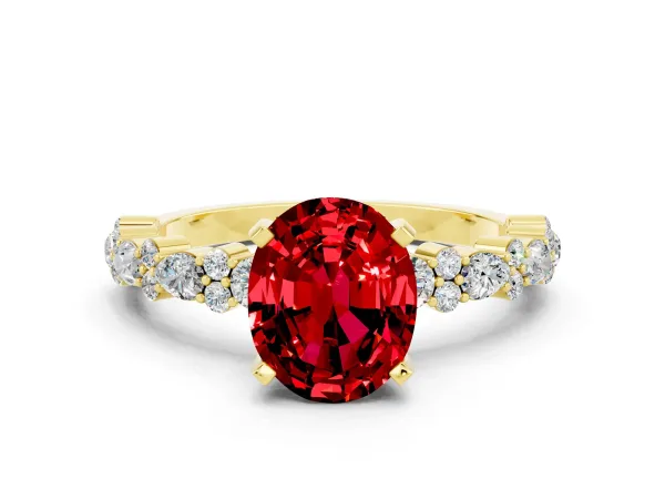 Oval Cut Ruby Side Stone Solitaire Ring with Round and Four-Prong Setting Yellow gold