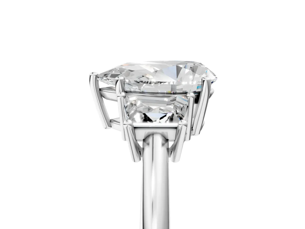 Pear Cut Diamond Three-Stone Ring with Trapezoid Side Stones and Prong Setting White gold