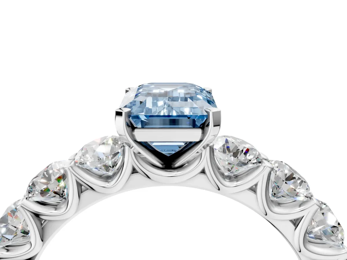 Fancy Blue Emerald Cut Diamond Prong Setting with Side Stones on a Pave Band Silver