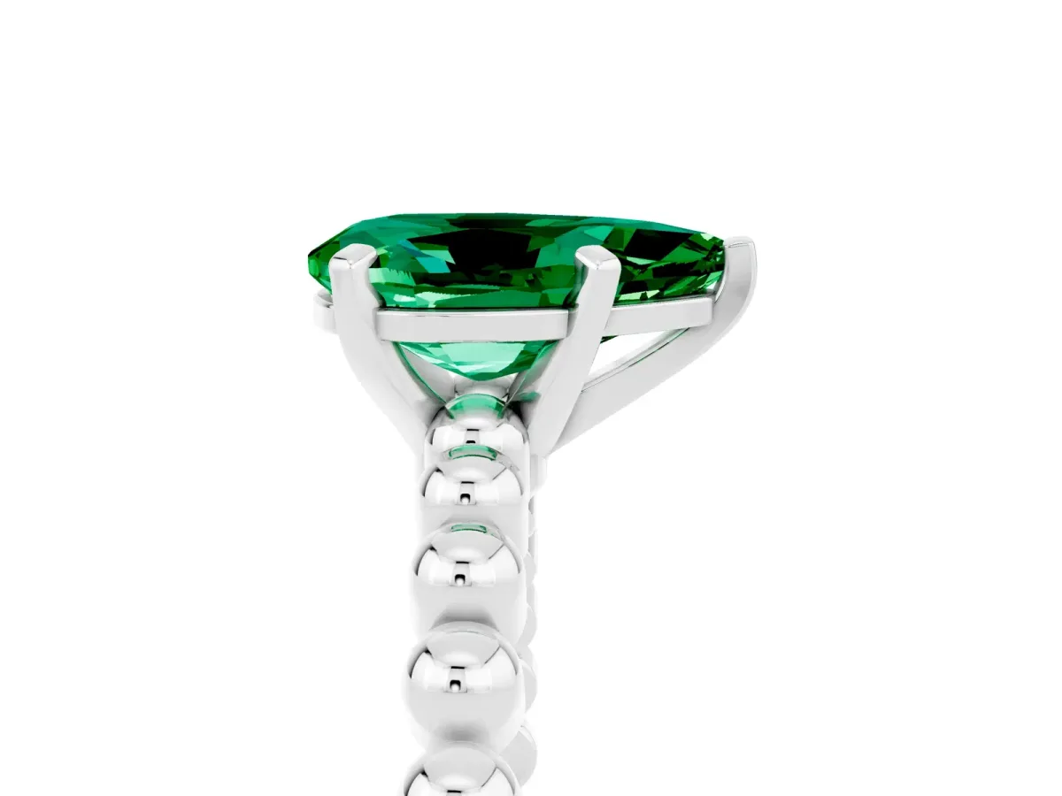 Pear Cut Emerald Solitaire Ring with Beaded Band and Prong Setting White gold