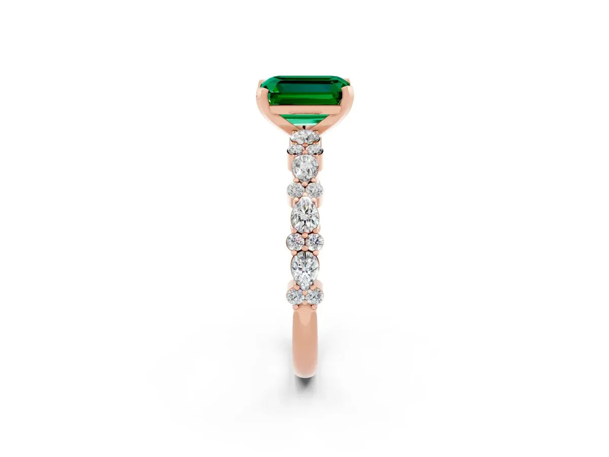 Emerald Cut Emerald Side Stone Solitaire Ring with Round and Four-Prong Setting Rose gold